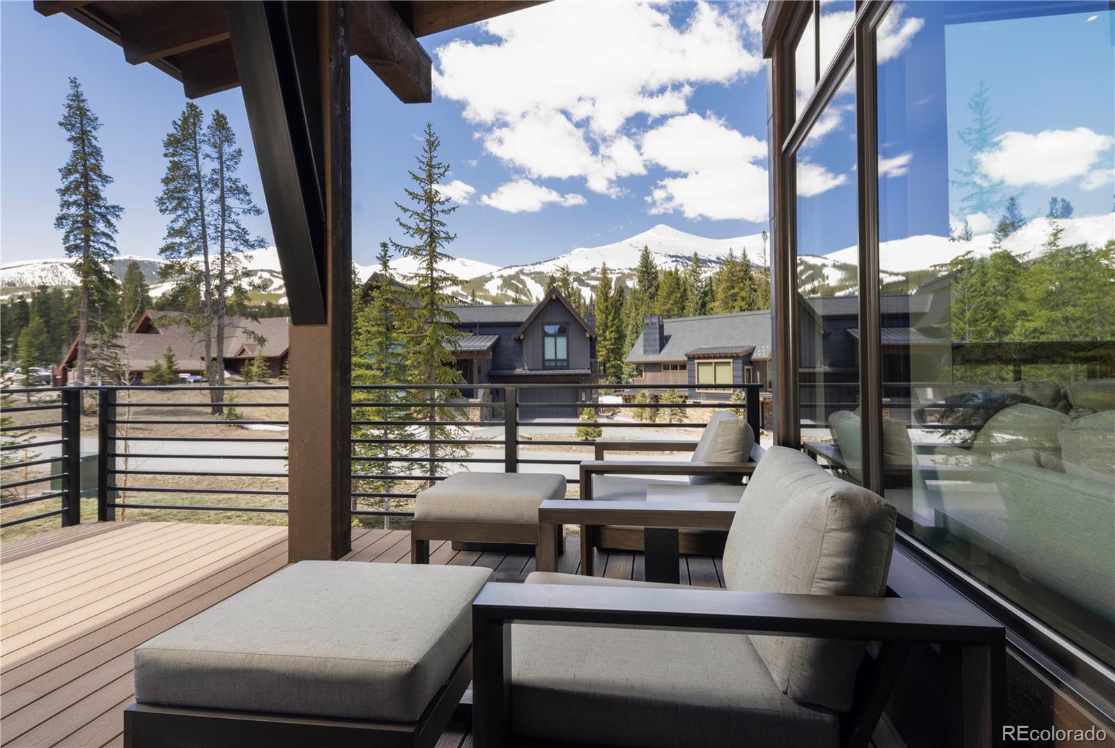 92 Cucumber Creek Road Breckenridge, CO 80424 - Photo 14 of 37 a view of a balcony with two chairs and a table