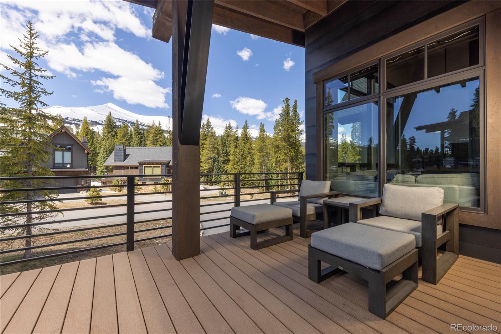 92 Cucumber Creek Road Breckenridge, CO 80424 - Photo 15 of 37 a balcony with wooden floor table and chairs