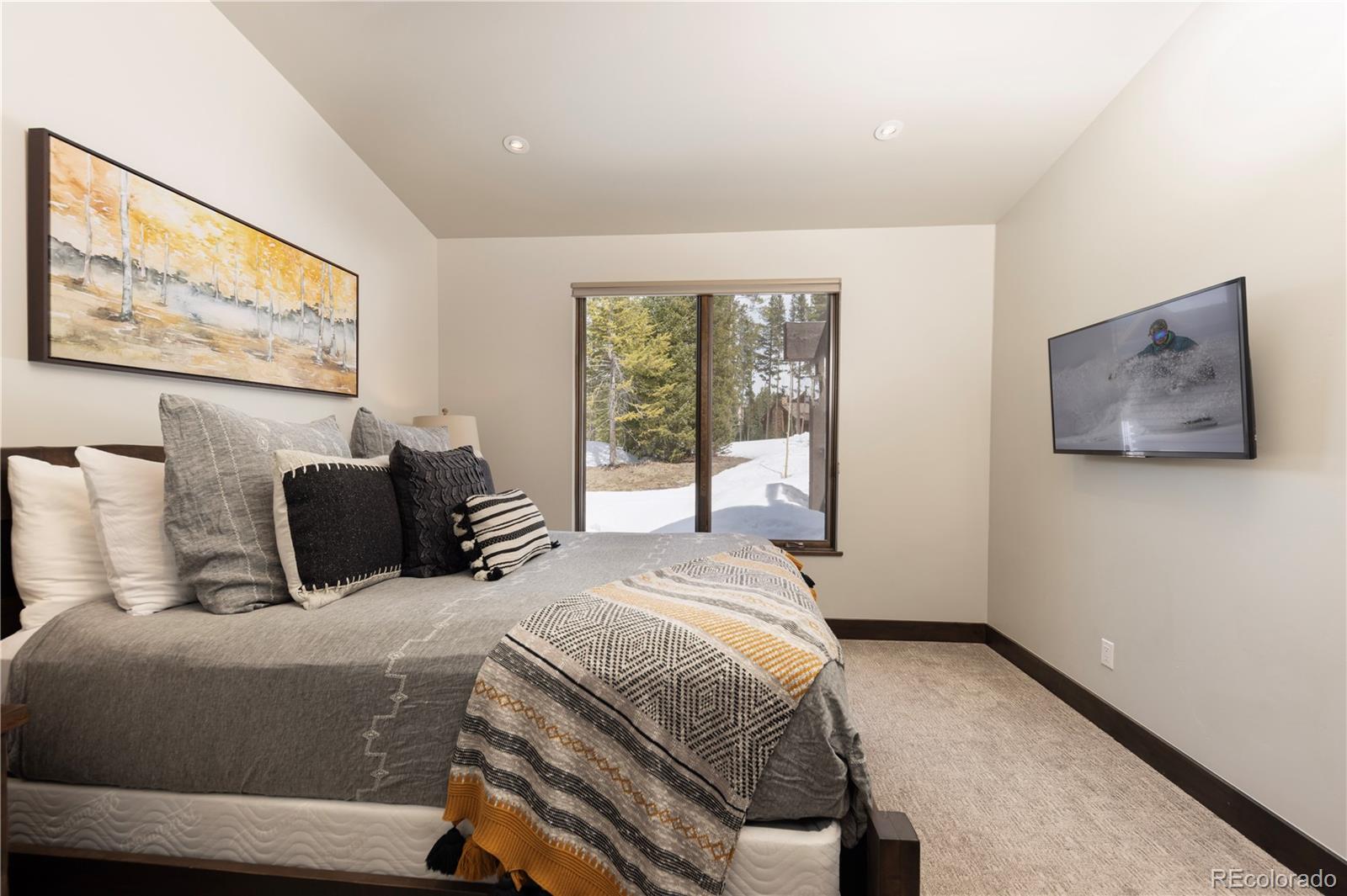 92 Cucumber Creek Road Breckenridge, CO 80424 - Photo 26 of 37 a bedroom with a large bed and a large window