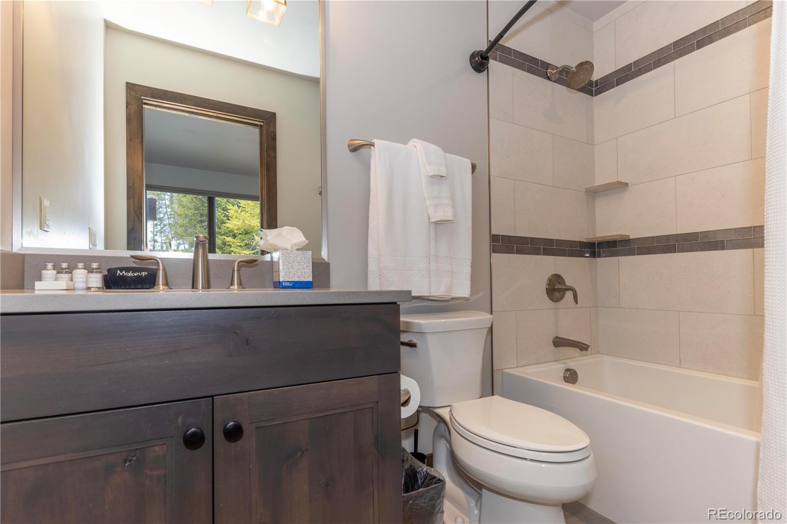 92 Cucumber Creek Road Breckenridge, CO 80424 - Photo 28 of 37 a bathroom with a sink toilet and shower