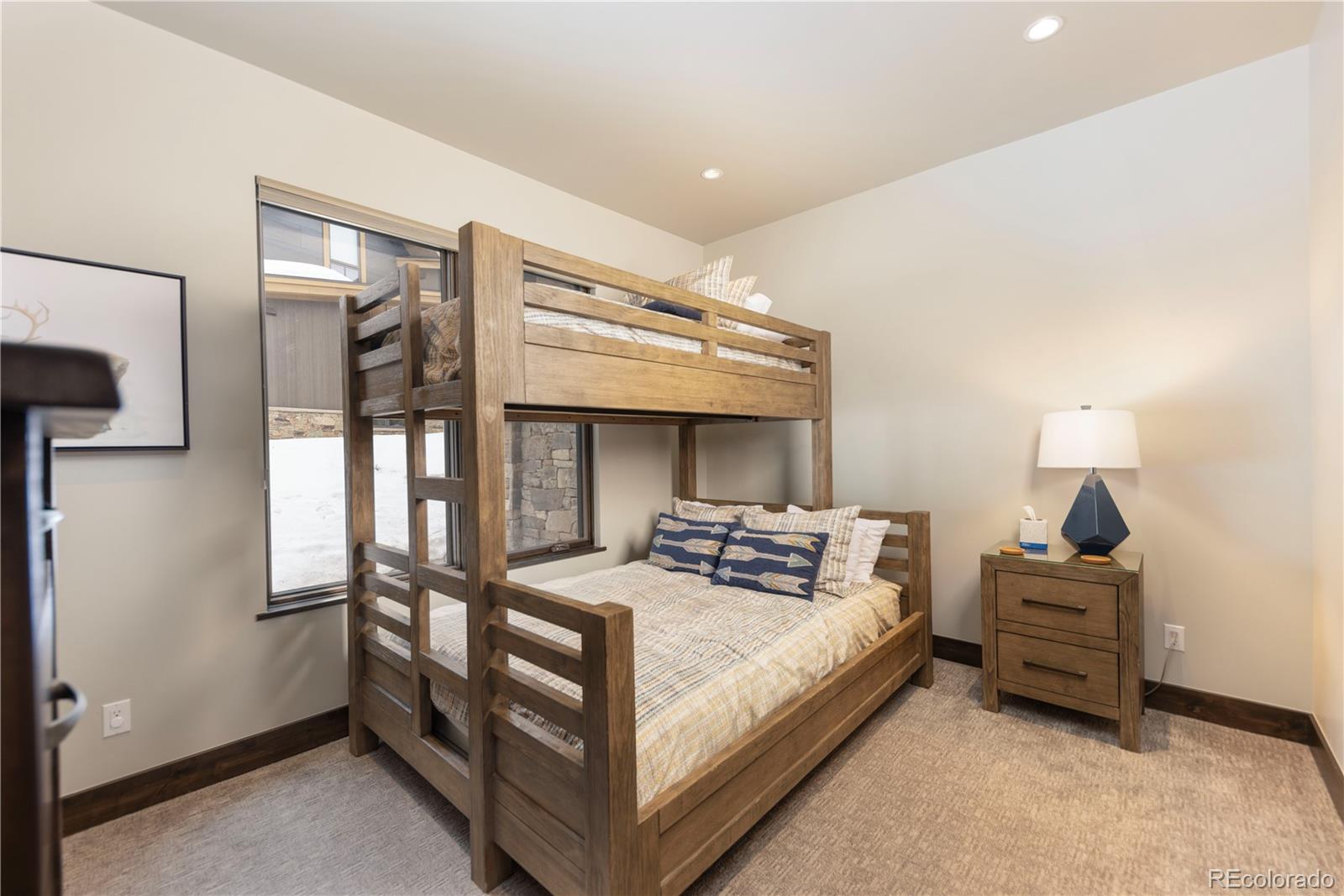 92 Cucumber Creek Road Breckenridge, CO 80424 - Photo 29 of 37 a bedroom with a bed next to a window