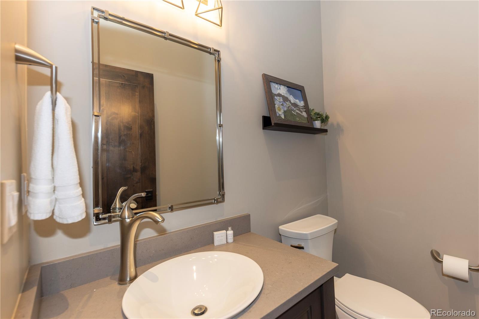 92 Cucumber Creek Road Breckenridge, CO 80424 - Photo 30 of 37 a bathroom with a toilet sink and mirror