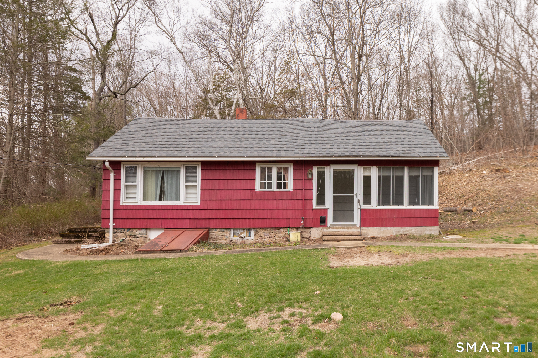60 Chestnut Lane Hamden, CT 06518 - Photo 1 of 1 a front view of a house with a garden