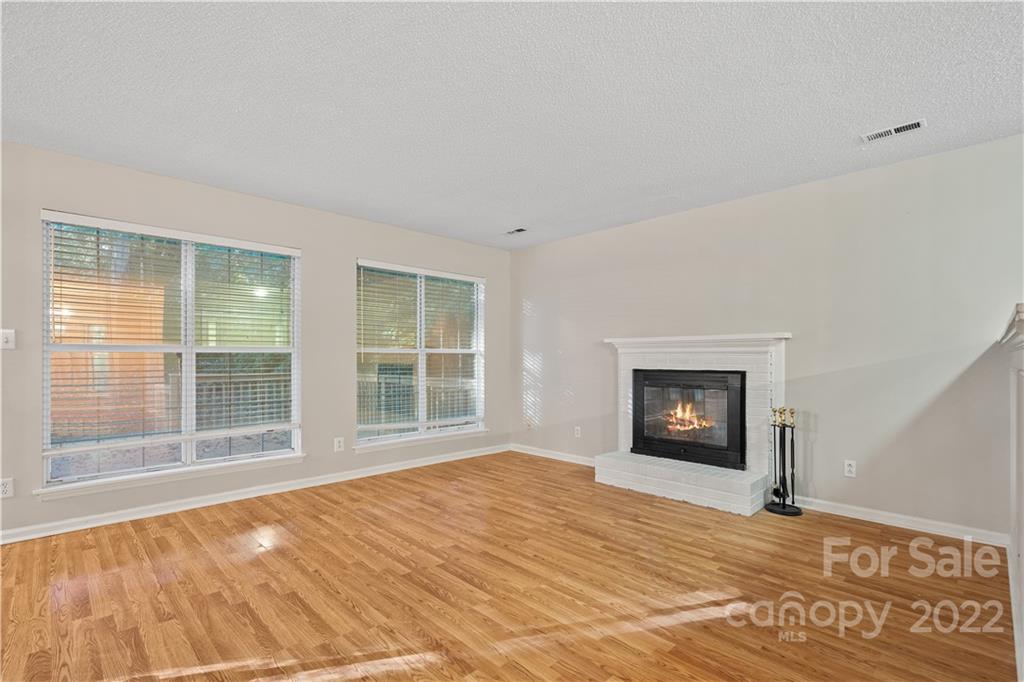 12021 Danby Road Pineville, NC 28134 - Photo 11 of 27 a view of empty room with a fireplace