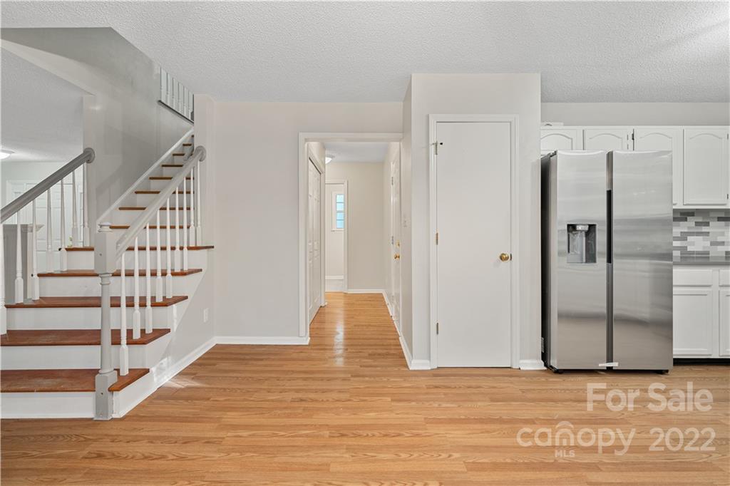 12021 Danby Road Pineville, NC 28134 - Photo 2 of 27 a view of entryway with wooden floor