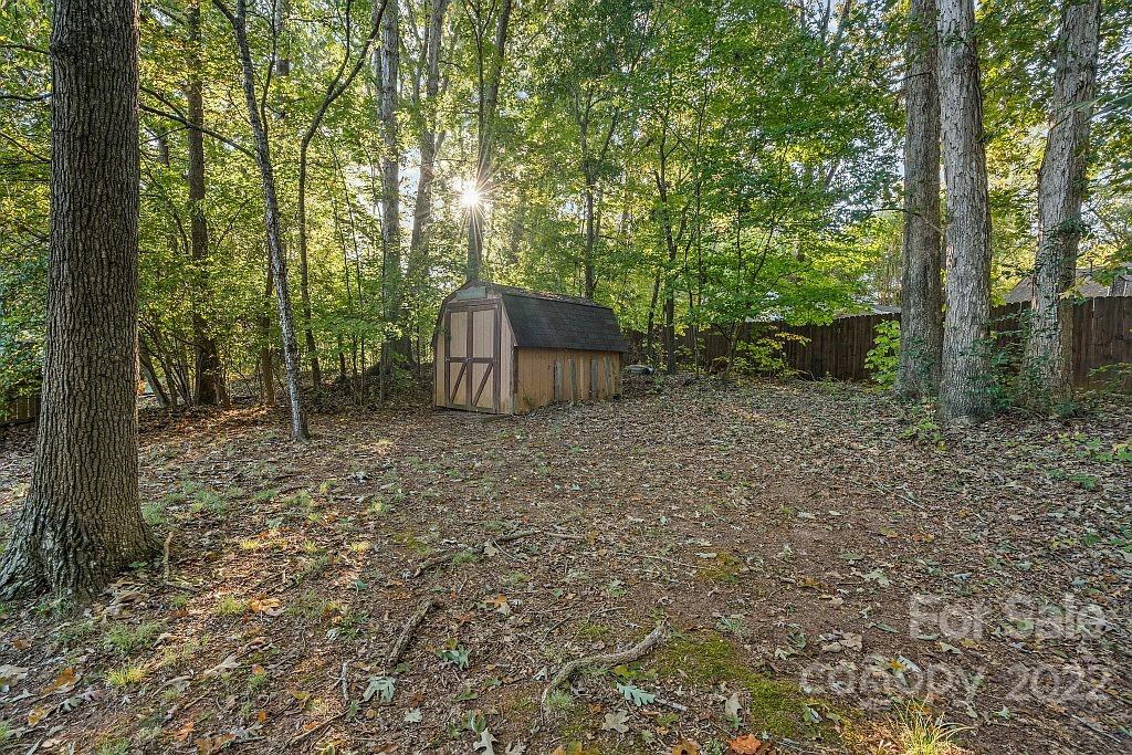 12021 Danby Road Pineville, NC 28134 - Photo 27 of 27 a backyard of a house with lots of green space
