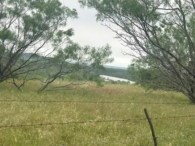 a view of a lake from a balcony
