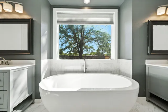 a white bath tub sitting in a bathroom