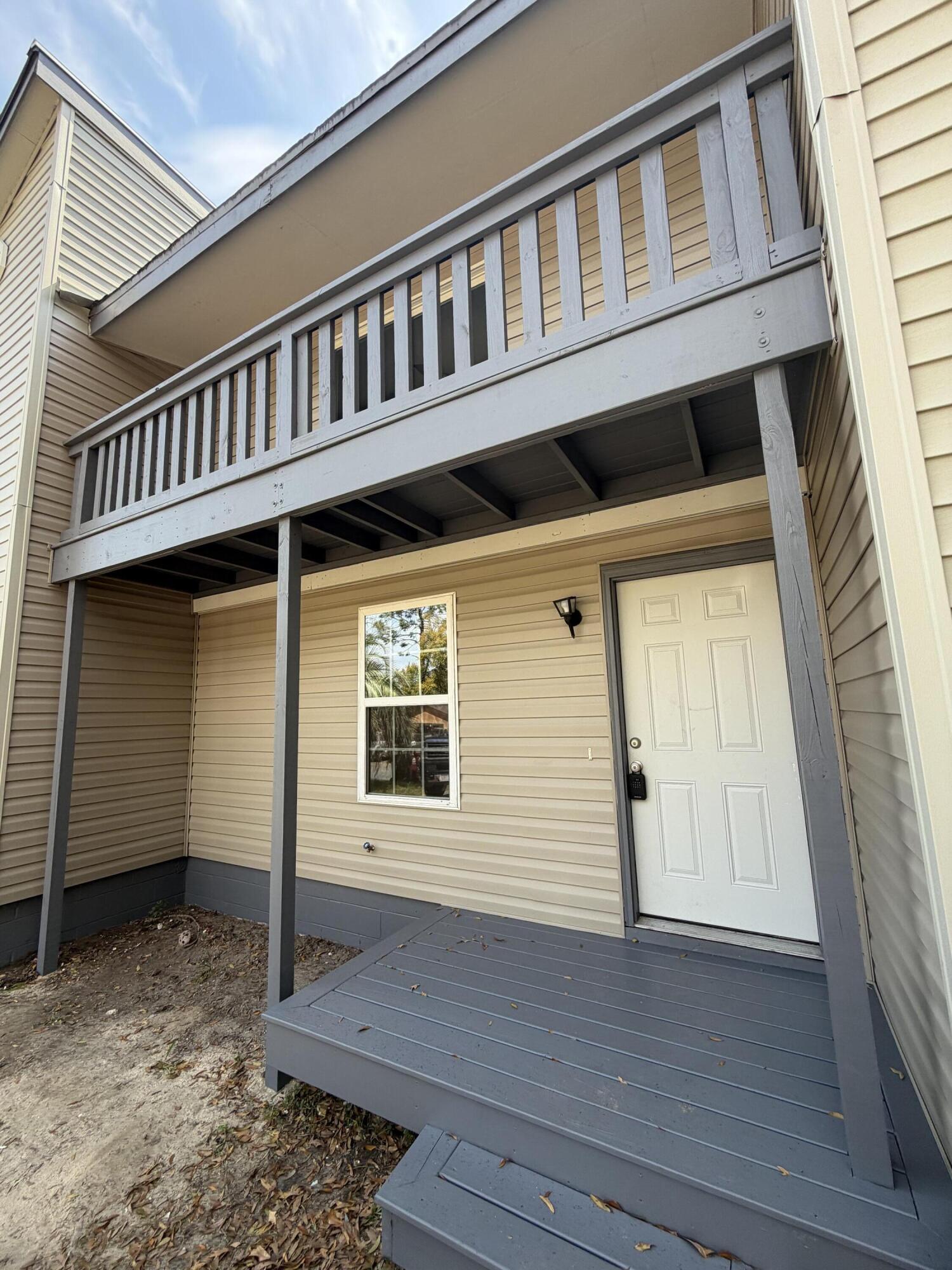 a front view of a house with a balcony