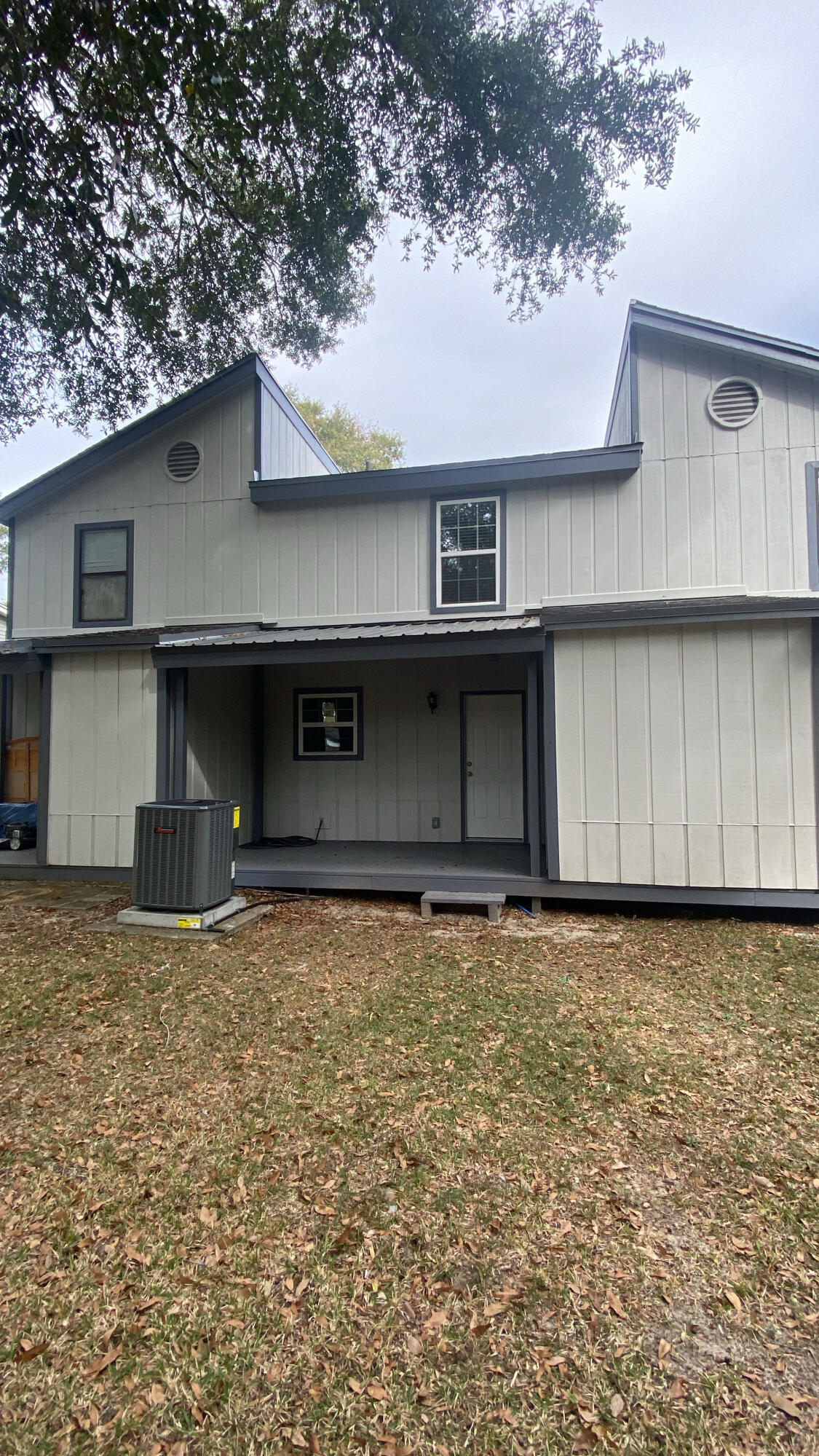 122 Hampton Drive Crestview, FL 32539 - Photo 2 of 12 a front view of a house with garage
