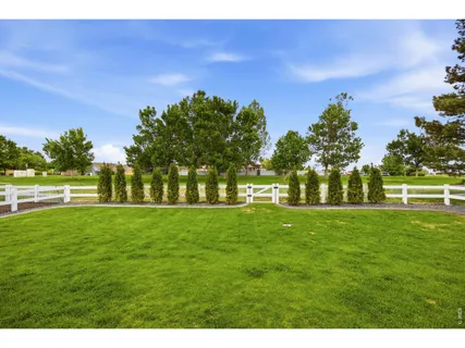 a backyard of a house with lots of green space