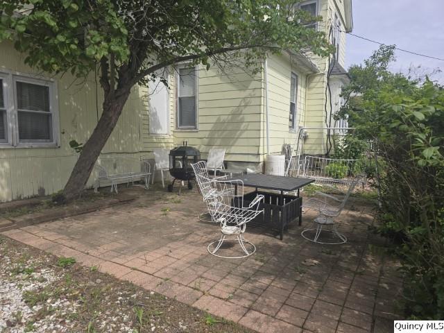 210 Main Street Carthage, IL 62321 - Photo 32 of 36 a view of a house with backyard and sitting area