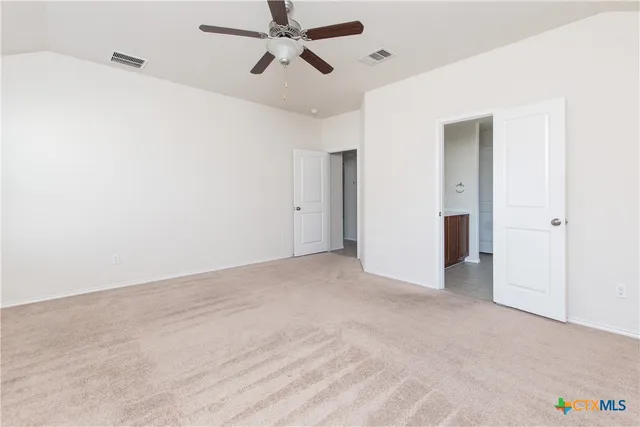 a view of a big room with carpet