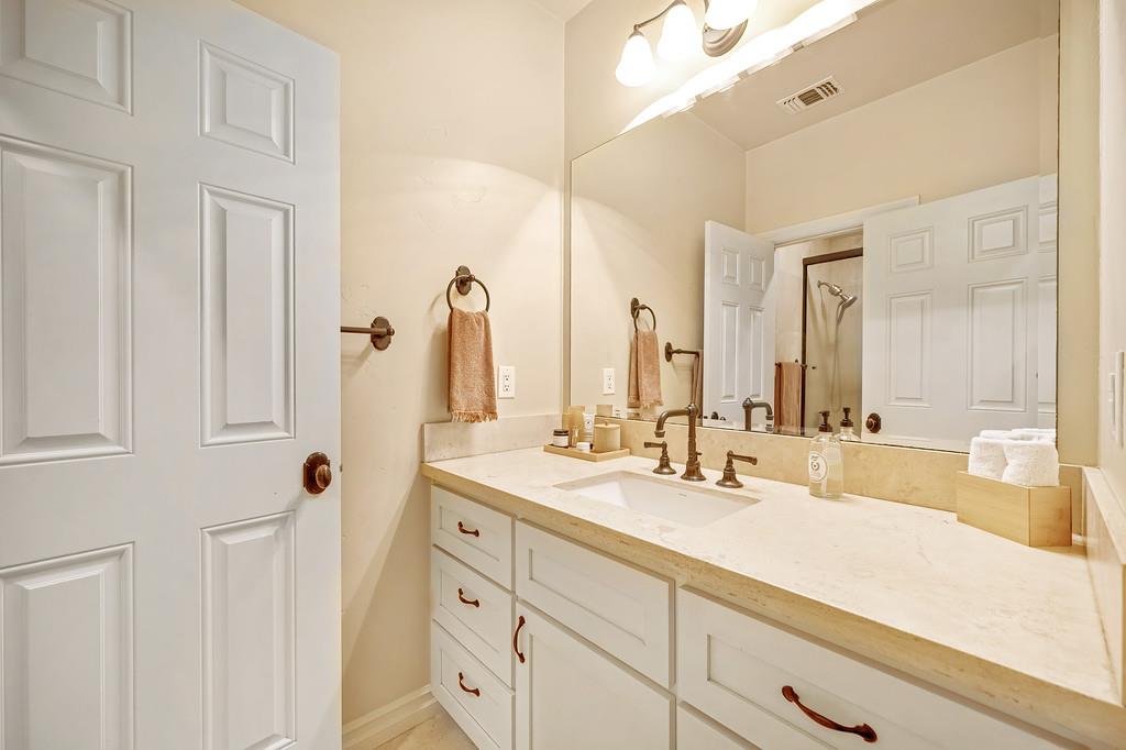 3557 Val Verde Road Loomis, CA 95650 - Photo 37 of 71 a bathroom with double vanity sink and a mirror