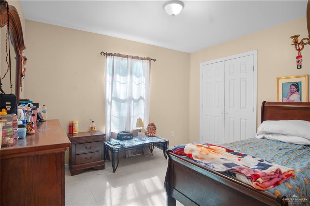 2302 Paris Street Mission, TX 78574 - Photo 14 of 25 a bedroom with a bed and a window