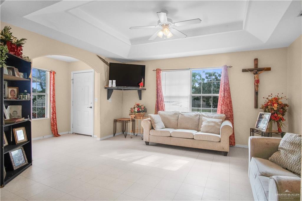 2302 Paris Street Mission, TX 78574 - Photo 7 of 25 a living room with furniture and a flat screen tv
