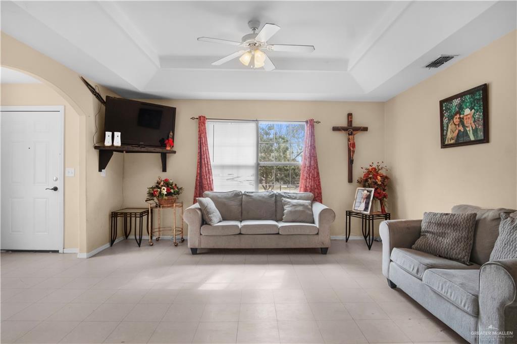 2302 Paris Street Mission, TX 78574 - Photo 8 of 25 a living room with furniture and a large window