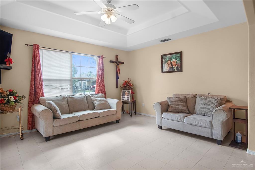 2302 Paris Street Mission, TX 78574 - Photo 9 of 25 a living room with furniture and a large window