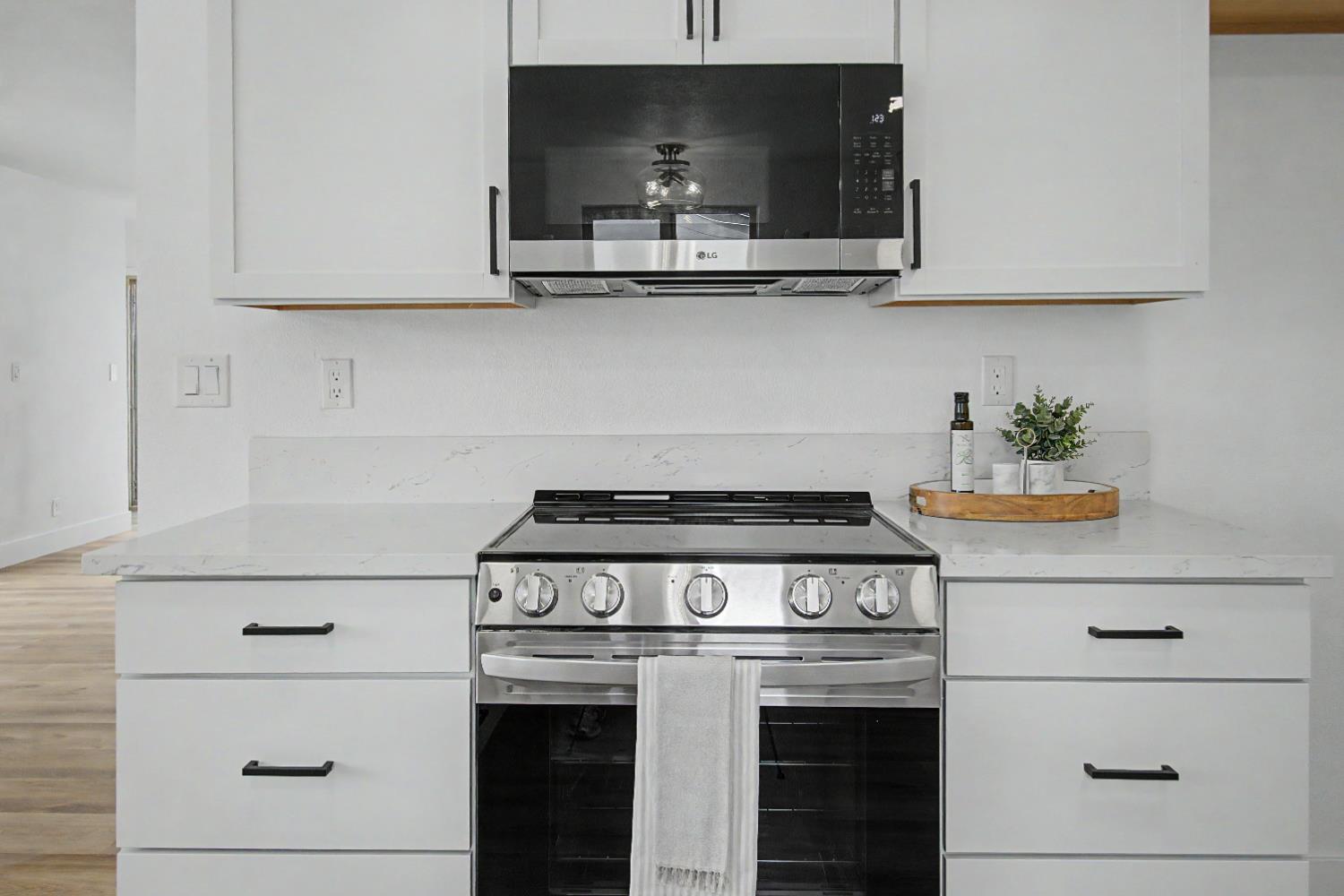 3184 Topeka Drive Merced, CA 95348 - Photo 10 of 26 Stainless steel appliances, contrast of white with black & gold finish.