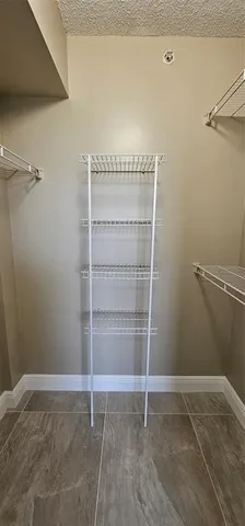 a view of an empty walk in closet