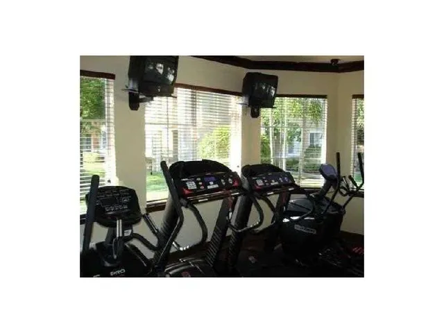 a view of a park with swings and slides