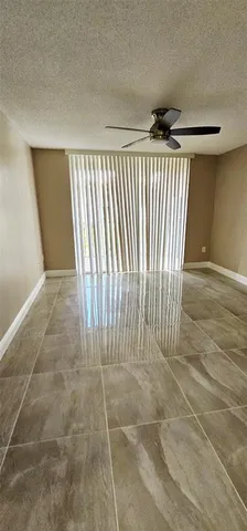 wooden floor in a hall with a window