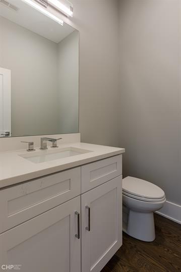 562 West 18th Street, Unit 3W Chicago, IL 60616 - Photo 12 of 14 a bathroom with a toilet sink and mirror