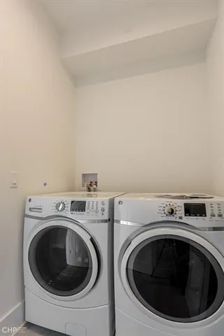 a utility room with dryer and washer