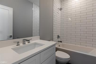 562 West 18th Street, Unit 3W Chicago, IL 60616 - Photo 7 of 14 a bathroom with a sink toilet and shower