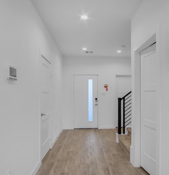 14258 Wonder Lake Lane Conroe, TX 77384 - Photo 3 of 12 wooden floor in an empty room with a gallery