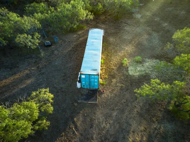 a view of house with a yard