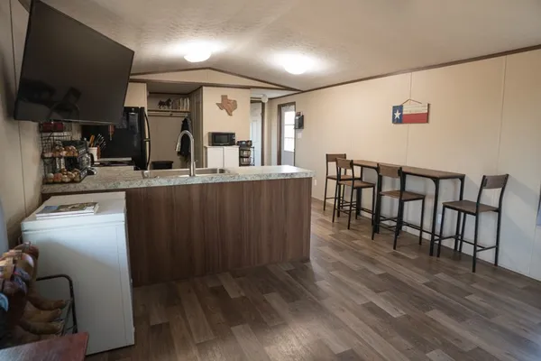 a view of a storage & utility room with two washing machine