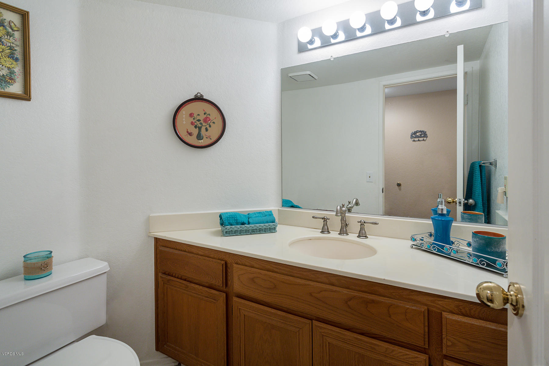 75 Valley Crest Road Simi Valley, CA 93065 - Photo 16 of 33 a bathroom with a sink and a mirror