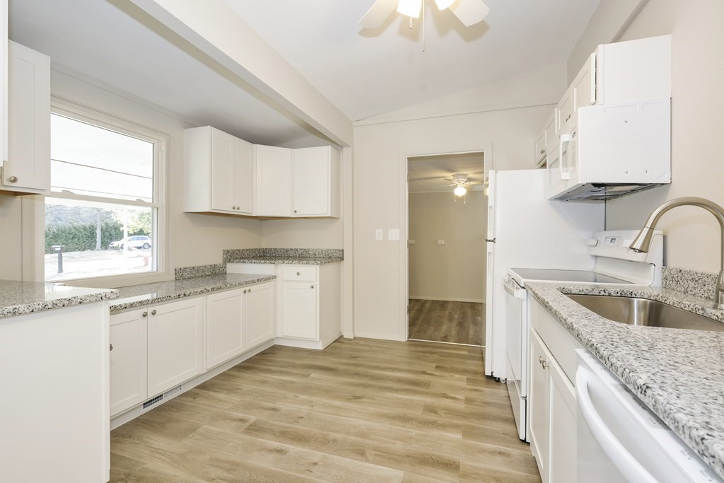 1261 Burts Pit Road Northampton, MA 01062 - Photo 11 of 21 a kitchen with granite countertop a sink stove and cabinets