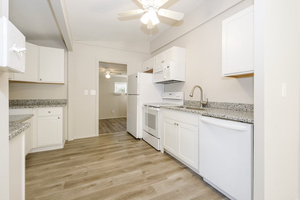 1261 Burts Pit Road Northampton, MA 01062 - Photo 12 of 21 a kitchen with granite countertop white cabinets and white appliances