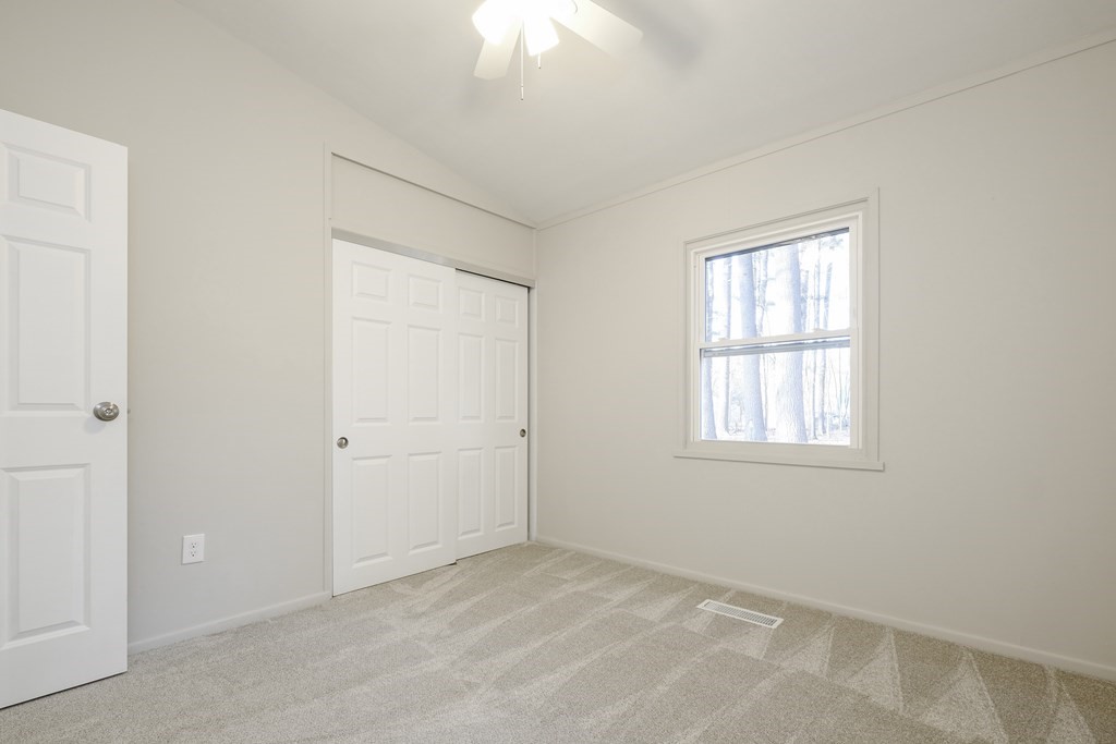 1261 Burts Pit Road Northampton, MA 01062 - Photo 17 of 21 an empty room with windows and closet