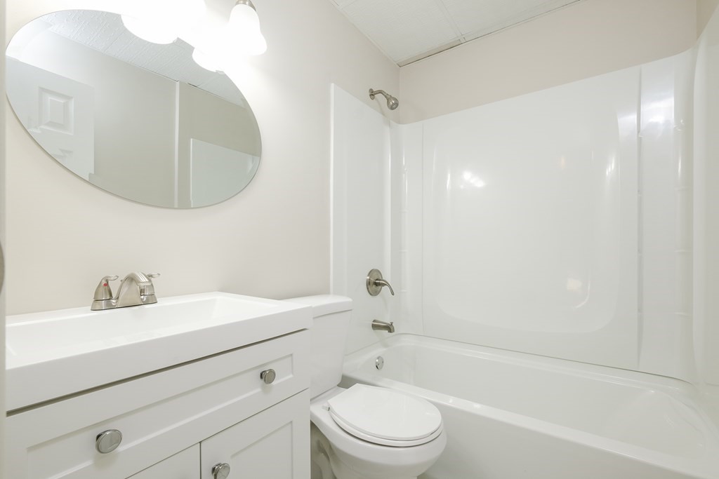 1261 Burts Pit Road Northampton, MA 01062 - Photo 18 of 21 a bathroom with a sink a toilet and a mirror