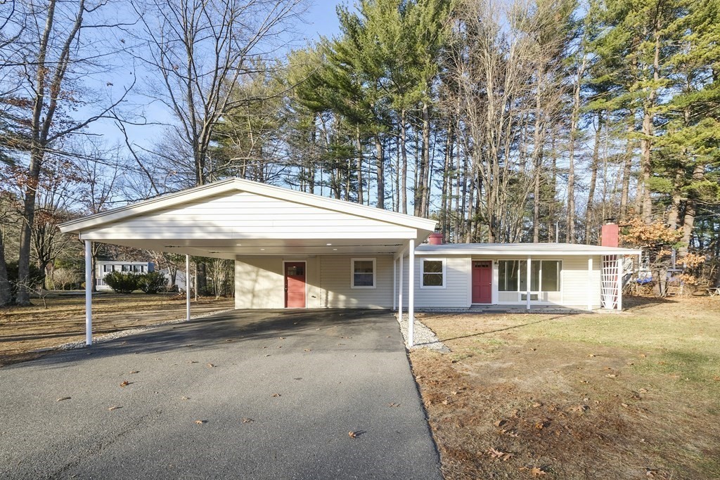 1261 Burts Pit Road Northampton, MA 01062 - Photo 2 of 21 a view of a white house with a large space and large trees