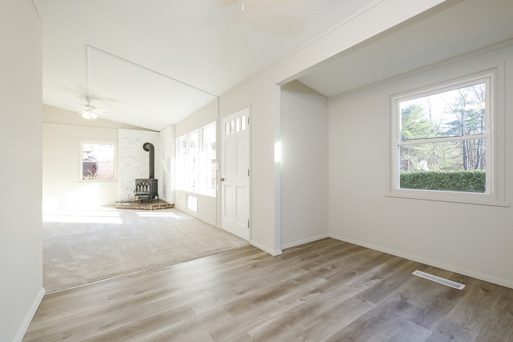 1261 Burts Pit Road Northampton, MA 01062 - Photo 6 of 21 an empty room with wooden floor and windows