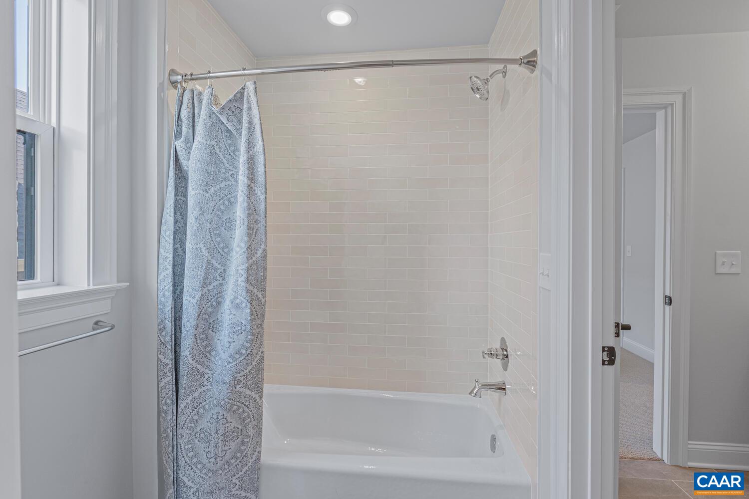 1731 Fowler Street Charlottesville, VA 22901 - Photo 35 of 45 a bathroom with a shower and a bath tub