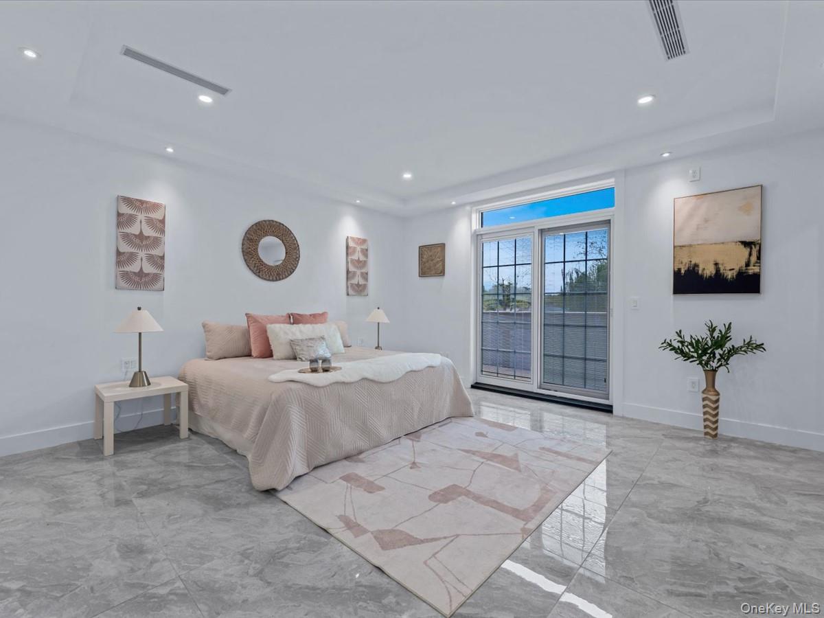 233-12 Bay Street Queens, NY 11363 - Photo 19 of 46 Bedroom featuring access to exterior and recessed lighting