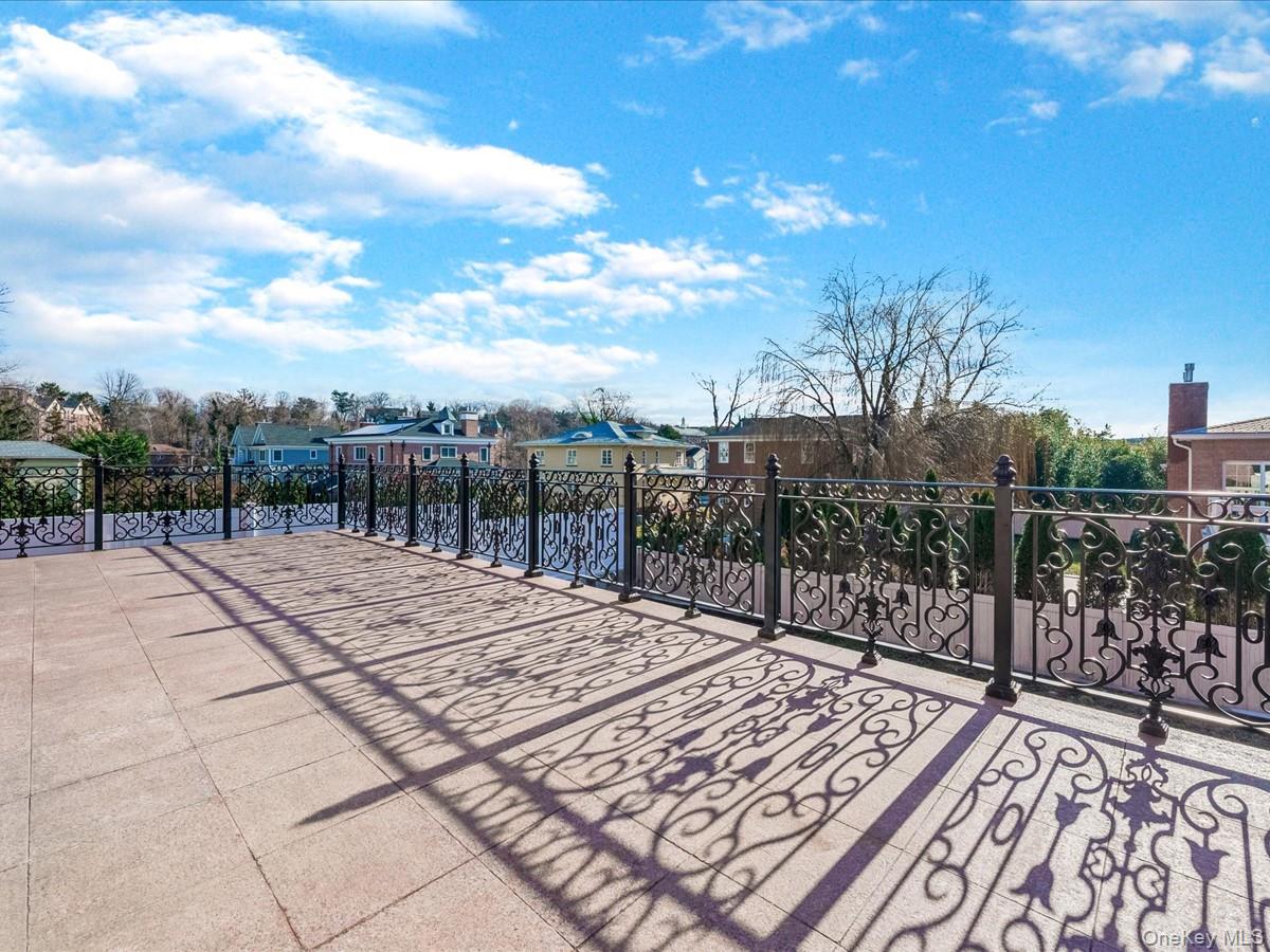 233-12 Bay Street Queens, NY 11363 - Photo 36 of 46 View of patio / terrace featuring a residential view