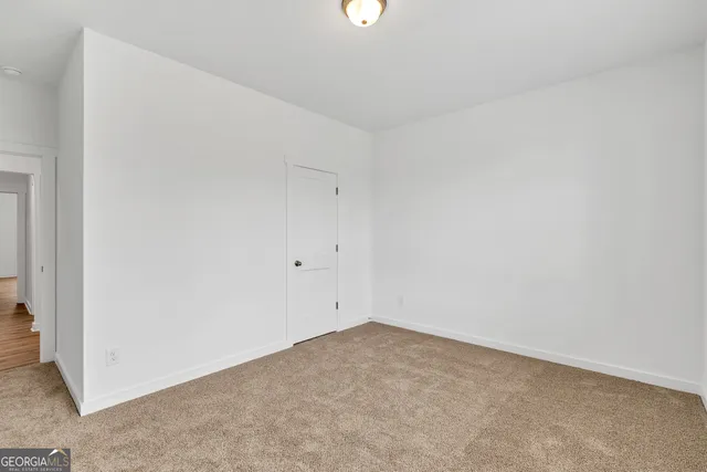 a bathroom with a sink toilet vanity and shower