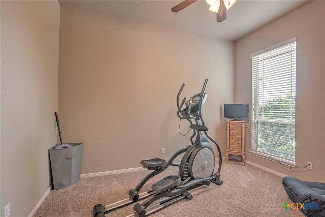 623 Coventry Drive Temple, TX 76502 - Photo 26 of 38 a room with gym equipment and windows