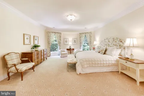 a spacious bedroom with a bed and a couch