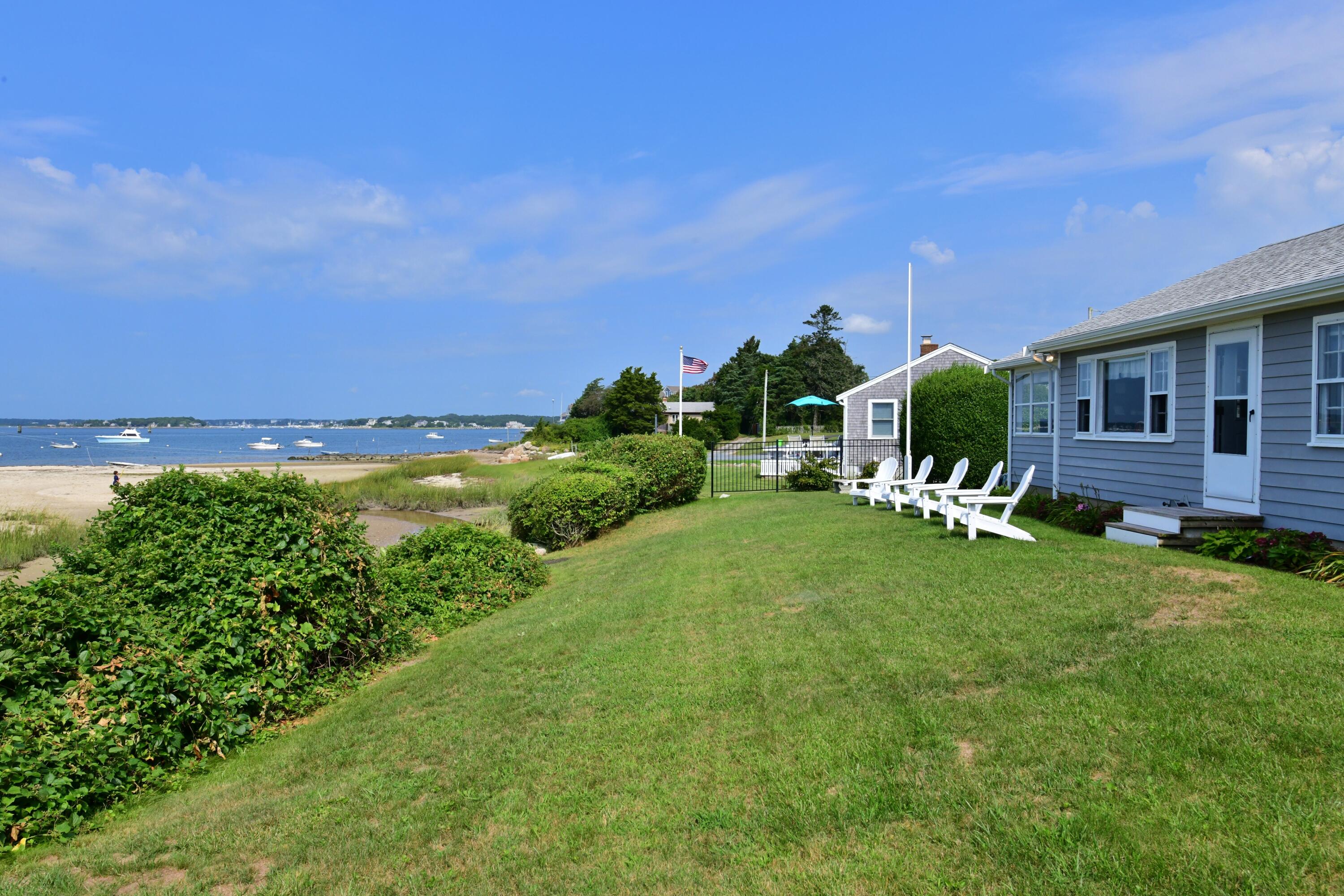 5 Spindrift Lane, Unit WINTER Buzzards Bay, MA 02532 - Photo 2 of 34 a garden view with a seating space