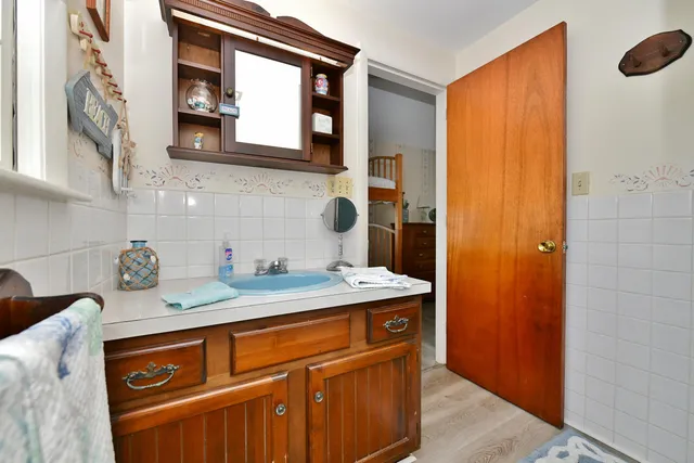 a close view of sink and mirror