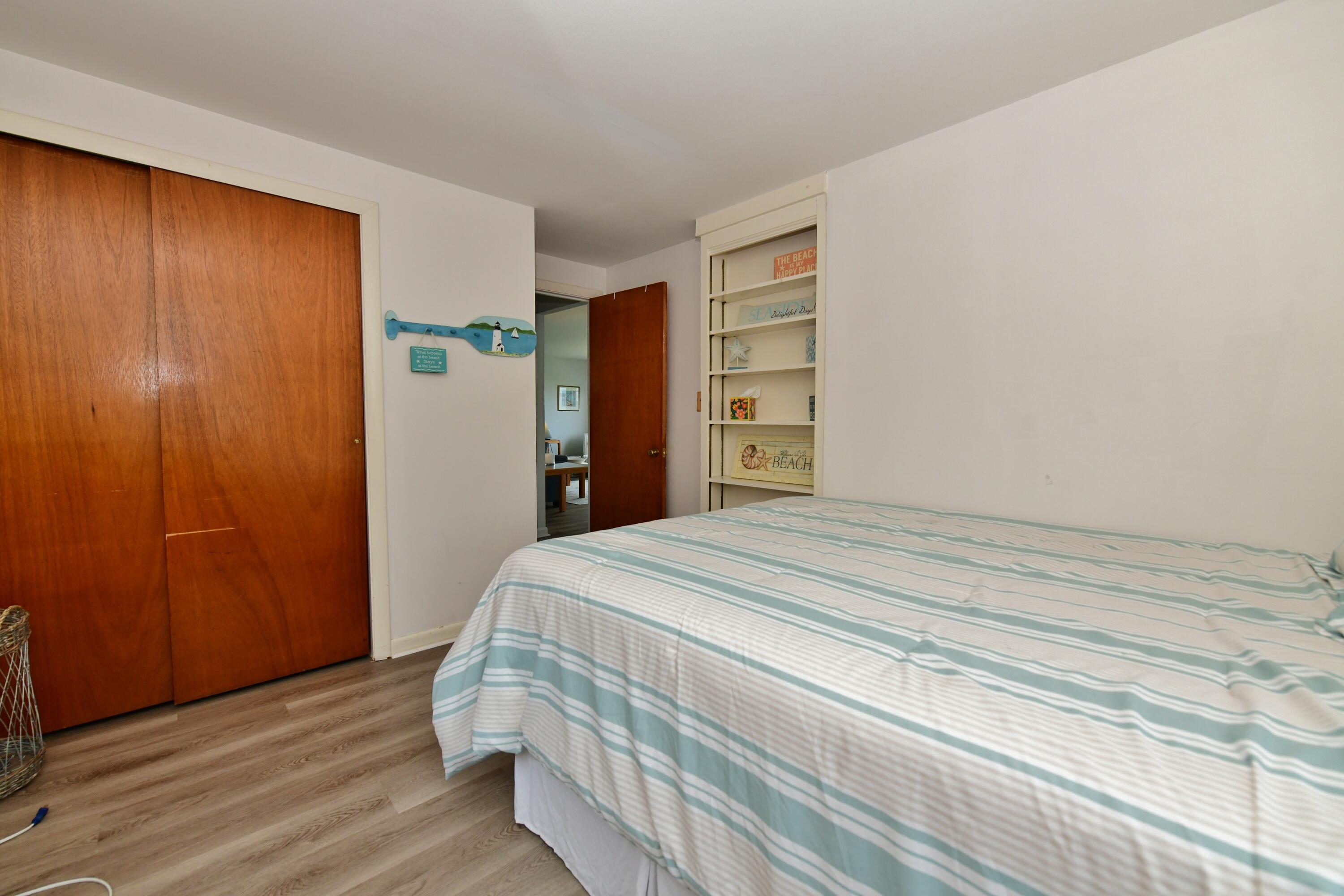 5 Spindrift Lane, Unit WINTER Buzzards Bay, MA 02532 - Photo 32 of 34 a bedroom with a bed and a closet