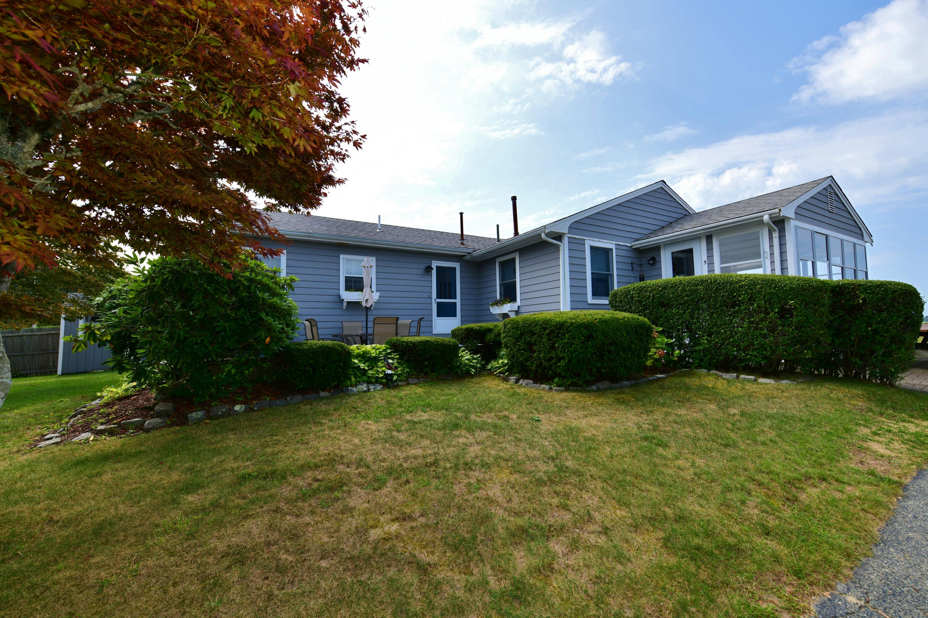 5 Spindrift Lane, Unit WINTER Buzzards Bay, MA 02532 - Photo 8 of 34 a view of a house with a backyard