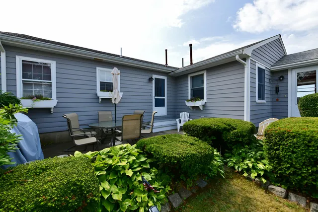 a backyard of a house with seating space